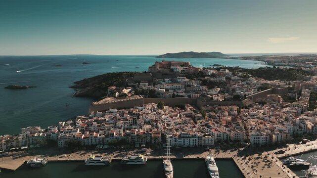 Drone shot overlooking Ibiza old town with Dalt Villa in backdrop.