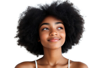 Radiant Reflection: A close-up shot of a young woman with an afro gazing upwards, her face illuminated by a soft, dreamy light. A glimpse into youthful hope and natural beauty.
