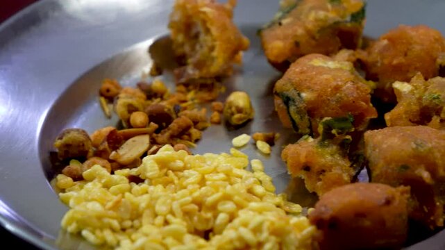 Close Up shot of Pokara Channa and Badam pan shot