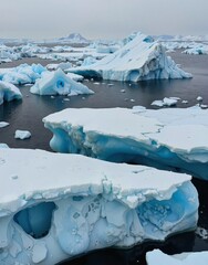 A serene scene of floating icebergs in a calm sea, showcasing the majestic beauty of glacier ice formations