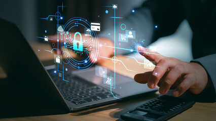 Cybersecurity protection concept with a hand touching a glowing padlock and shield icon, representing data security, encryption, and secure digital access in a high-tech environment.