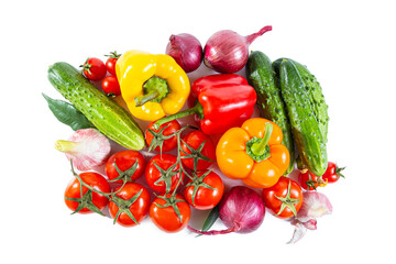 Mix of colorful vegetables - bell pepper, tomatoes, cucumbers, onions and garlic. Isolated on white.