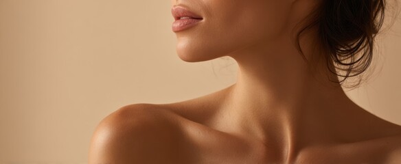 The elegant profile of a woman showcasing beauty and grace in soft light.