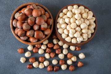 Heap of peeled and shelled hazelnuts on black background,top view