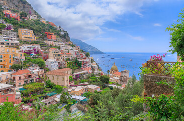 Obraz premium Amalfi Coast: panoramic view of Positano townscape with the church of Holy Mary Assumption in southern Italy.