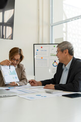 Senior businessmen analyzing data.