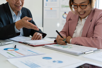 Senior businessmen analyzing data together.