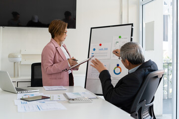 Senior businessmen analyzing data.