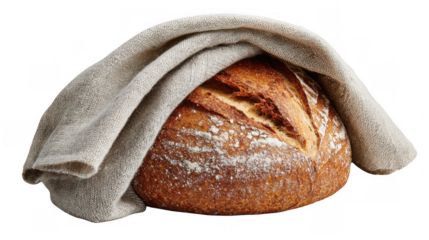 Freshly baked, round loaf of artisan bread rests majestically, enveloped by a textured linen cloth, against a transparent background, creating a rustic and inviting scene