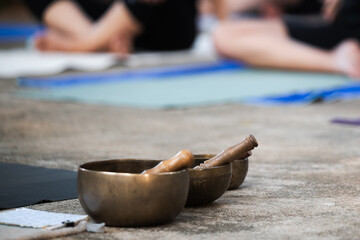Background of tibetan singing bowls relaxing on floor after yoga class