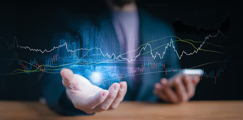 Financial growth and investment concept: A person holding a holographic projection of city skylines and dynamic stock market charts, symbolizing economic trends.