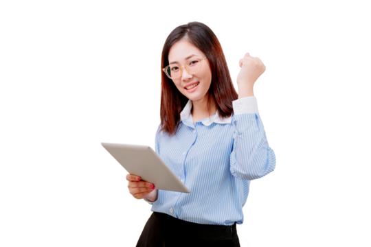 Asian young beautiful woman in glasses holding a tablet and making a triumphant gesture with her fist.