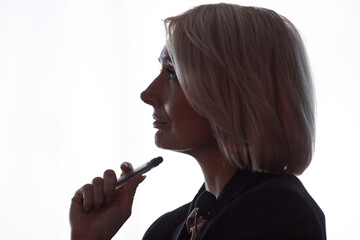 Plakat Side view of thoughtful female conference participant actively listening to presenters speech attending lecture on latest AI technology updates captured in auditorium against window