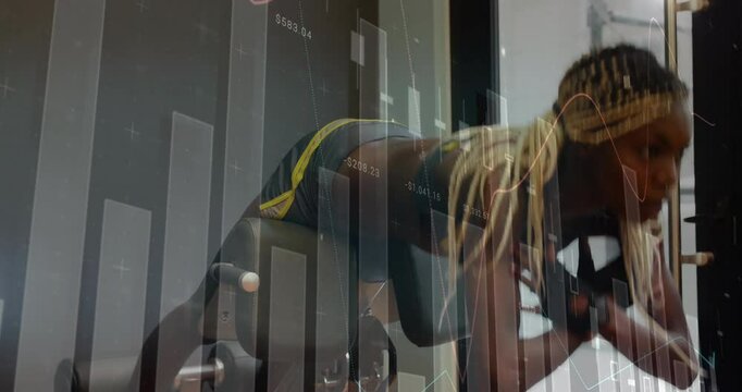 Woman stepping onto bench and securing feet doing back extensions in gym with finance chart overlay