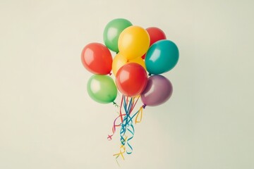 Colorful balloons float joyfully against a serene white backdrop, creating a vibrant celebration of happiness and life