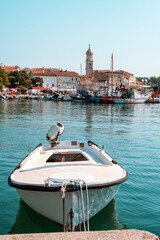 A boat moored at the pier in Krk, Croatia