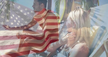 Couple making call and pointing at ocean with animated USA flag overlay for travel marketing - Powered by Adobe
