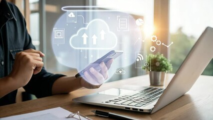 Person using smartphone and laptop for cloud computing and data transfer - Powered by Adobe