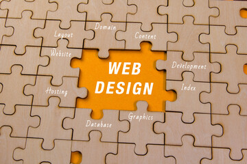 Creative web design puzzle pieces on a wooden background