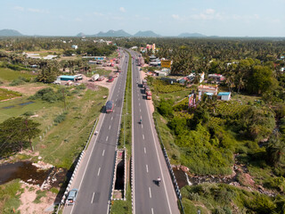Scenic highway with lush landscapes and distant mountains