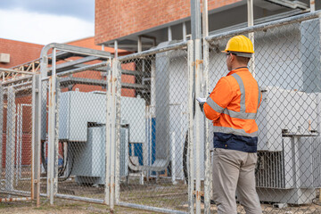 Asian electrical engineer inspect the electrical systems, Electric construction and maintenance...