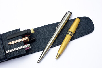 A black leather ballpoint holder. This item is classified as a luxury item, usually used for business people to look exclusive.
