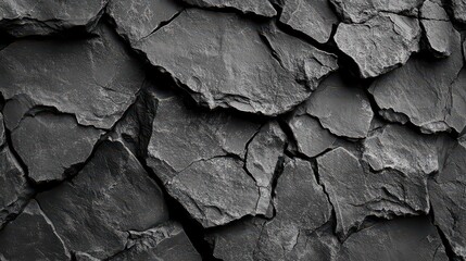 A charcoal slate texture featuring irregular cracks and a slightly rough texture