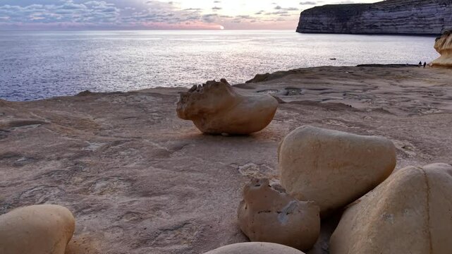  Maltas coastline and unique rock formations at sunset