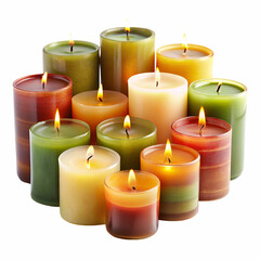 A collection of colorful burning candles with warm glowing flames on white background