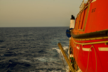Big Lifeboat on a cable ship underway at sea in the morning