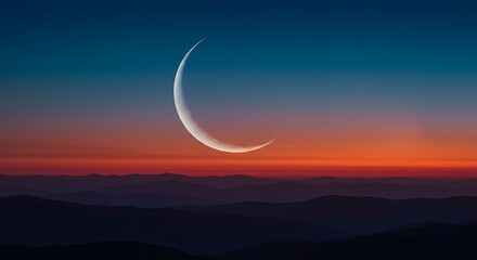 Crescent Moon Rising Over Mountain Ridges at Dusk