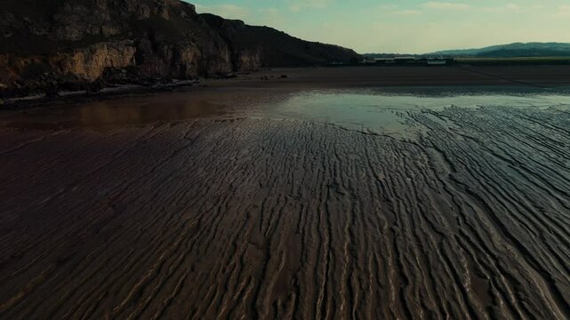 Drone shot revealing rill marks in sandy beach, Burnham-On-Sea, UK.