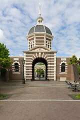 The historic Morspoort in Leiden, Netherlands, stands as a grand city gate with its iconic dome and brick archway. A perfect representation of Dutch heritage and architectural beauty.
