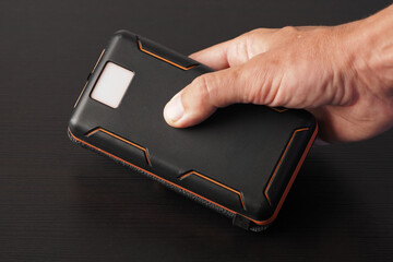 Big Power Bank with Flashlight in hand.