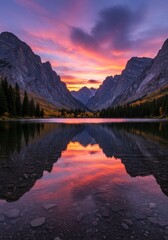 Obraz premium Mountain Lake Sunset Reflection - Serene mountain lake reflecting a vibrant sunset. Calm water, majestic peaks, colorful sky. Peaceful nature scene