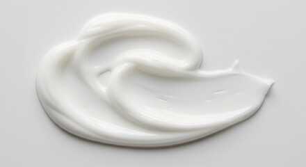 Smooth Creamy Lotion Swirl - Close-up of a swirl of white creamy lotion on a white background. Perfect for beauty and cosmetic product advertising