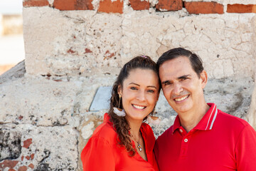 Young couple in Cartagena de Indias. Couple dressed in red. Love concept. Travel concept.