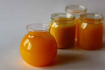 Homemade Cow Ghee. A clarified butter made by slow heating butter, creating a golden, clear liquid with a rich aroma