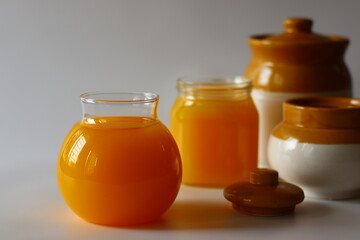 Homemade Cow Ghee. A clarified butter made by slow heating butter, creating a golden, clear liquid with a rich aroma