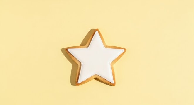 Star shaped cookie with white icing on a yellow background. Minimalist design for Independence Day. Pastry for memorial day template.