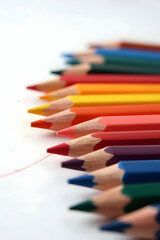 Fototapeta premium Rainbow of pencils laid out artistically