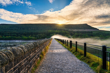 Fototapeta premium Morning mist over Ladybower dam in Peak district. United Kingdom 