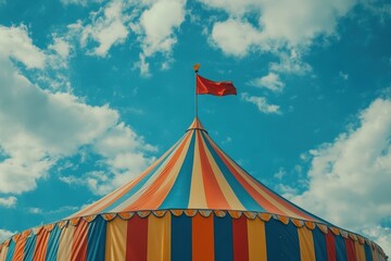 Colorful striped circus tent with a flag on top, Classic Carnival Festival Attraction
