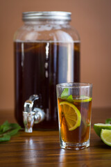 Natural fermented drink with mint and citrus on wood background