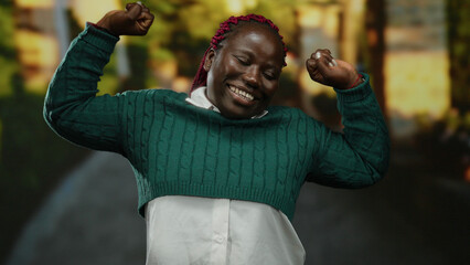 Woman enjoying in a sunlit park with greenery, wearing a cozy sweater, showcasing happiness and...