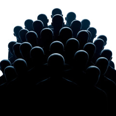 Obraz premium Silhouettes of people standing in the dark with their backs to the light.