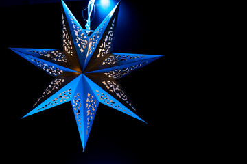 Blue Decorative Star Hanging Ornament. Decorative Star Lantern with Blue Lighting.