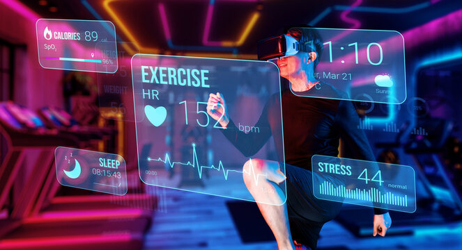 Happy asian man with VR glasses playing fitness while exercising at fitness. Male model using augmented reality and artificial intelligence to plan exercise plan while looking at hologram. Ingenuity.