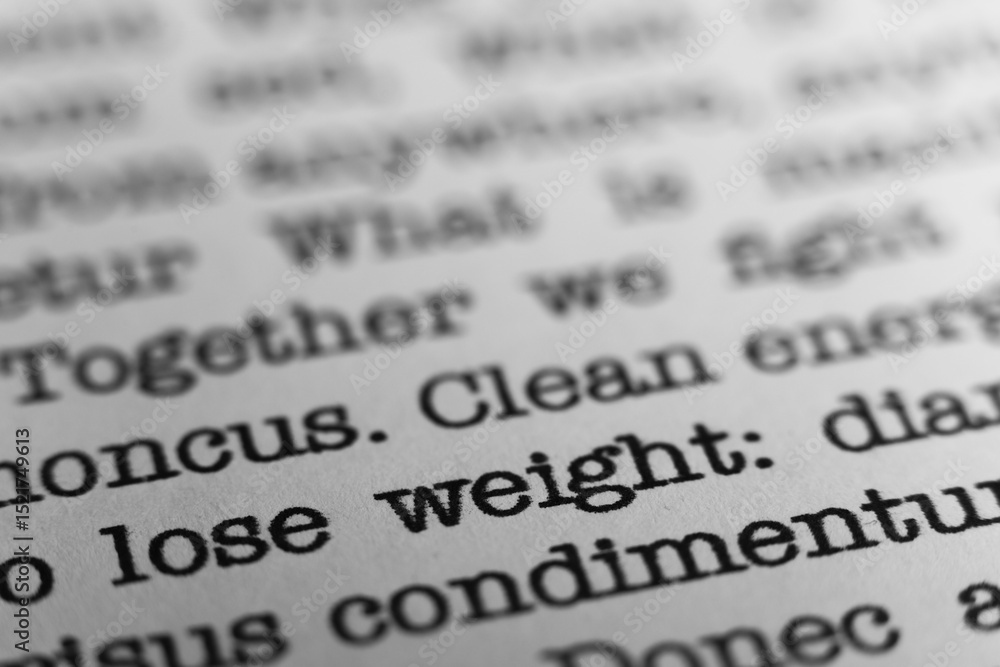 Fototapete lose weight. text printed on a page. a piece of paper with a phrase written in retro typewriter font