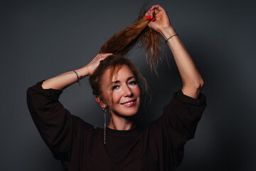 Young smiling woman studio fashion portrait